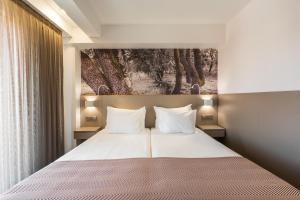 Postel nebo postele na pokoji v ubytování Serra d'Aire Boutique Hotel - SA Hotels