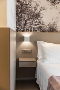 Postel nebo postele na pokoji v ubytování Serra d'Aire Boutique Hotel - SA Hotels