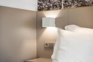 Postel nebo postele na pokoji v ubytování Serra d'Aire Boutique Hotel - SA Hotels