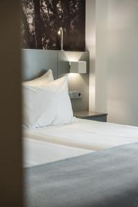 Postel nebo postele na pokoji v ubytování Serra d'Aire Boutique Hotel - SA Hotels