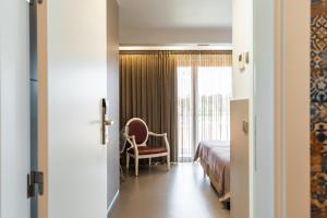 Postel nebo postele na pokoji v ubytování Serra d'Aire Boutique Hotel - SA Hotels