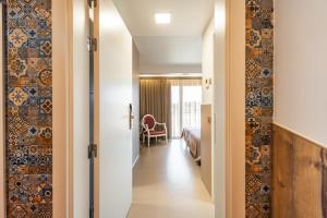 Postel nebo postele na pokoji v ubytování Serra d'Aire Boutique Hotel - SA Hotels