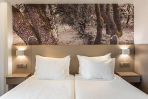 Postel nebo postele na pokoji v ubytování Serra d'Aire Boutique Hotel - SA Hotels