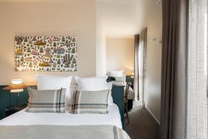 Postel nebo postele na pokoji v ubytování Hôtel L'Adresse - Entièrement rénové