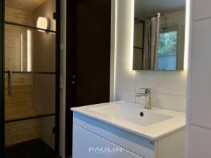a bathroom with a white sink and a shower at Lindvallen Ski Resort Pool and Padel - Sauna - 6 Guests - Pet Friendly in Sälen +19 photos