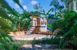 a small house in the middle of a forest at Casa Reina Tulum in Tulum