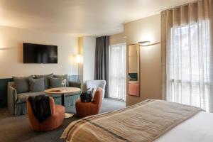 Postel nebo postele na pokoji v ubytování Hôtel L'Adresse - Entièrement rénové