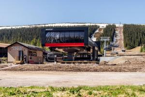 a building with a viewing platform in the middle at Lindvallen Ski Resort Pool and Padel - Sauna - 6 Guests - Pet Friendly in Sälen