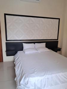 Postel nebo postele na pokoji v ubytování HotelCascol