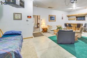 a bedroom with a bed and a living room at Townsend Cottage on UTV and Snowmobile Trail! in Townsend
