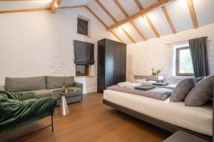 a bedroom with a large bed and a couch at Aurora Lukorana in Lukoran +47 photos