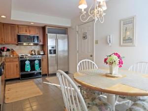 a kitchen and dining room with a table and chairs at 803 St James Place in Cape May