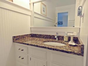 a bathroom with a sink and a mirror at 803 St James Place in Cape May +26 photos
