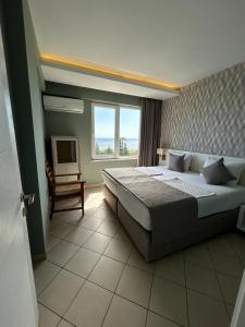 a bedroom with a large bed and a window at Havana Apart Hotel in Alanya +123 photos