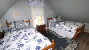 Ένα ή περισσότερα κρεβάτια σε δωμάτιο στο The Daisy Cottage- 2Nd And 3Rd Floor Unit
