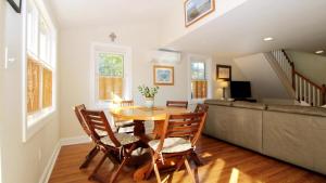 a dining room with a table and a couch at Ca De Cha in West Cape May