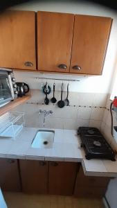 a kitchen with a sink and a counter top at Departamento Fran in La Plata