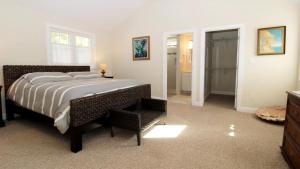 a bedroom with a large bed and a walk in closet at Ca De Cha in West Cape May