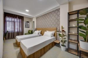 Letto o letti in una camera di Regraph Hotel