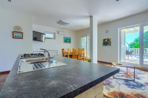 a kitchen with a sink and a counter top at Luxury Beach app P2 amazing location in Ivan Dolac