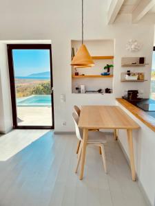 Kuchyň nebo kuchyňský kout v ubytování Spiti su in Paros - Naousa Piscina Privata + 30 fotografií