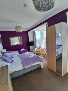 Ένα ή περισσότερα κρεβάτια σε δωμάτιο στο The Mounts Bay Inn