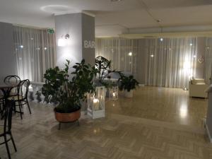 Posezení v ubytování Hotel Monaco - parcheggio incluso e piscina - min 2 gg