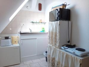 Kuchyň nebo kuchyňský kout v ubytování Gemütlichkeit