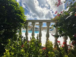 a view of the pool from the porch of a resort at Newly renovated studio in Simpson Bay +6 photos