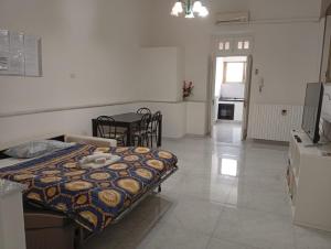 a kitchen and a dining room with a table and a room with a tableablish at Casa Maestrina in Benevento