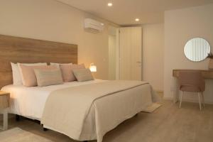 En eller flere senge i et værelse på Nina da Nazare - BY SCH