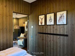 a bedroom with four pictures of animals on the wall at Lindvallen Ski Resort Pool and Padel - Sauna - 4 Guests in Sälen