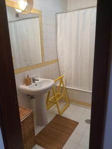 a bathroom with a sink and a shower at Boho Beach Apartment in Praia de Mira