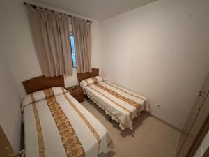 Postel nebo postele na pokoji v ubytování Apartamentos Marina Park