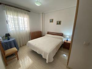 Postel nebo postele na pokoji v ubytování Apartamentos Marina Park