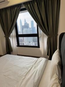 Ein Bett oder Betten in einem Zimmer der Unterkunft Agile Milestone service suite TRX by KL