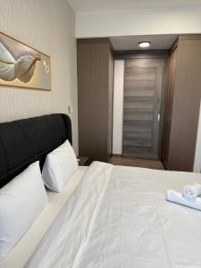 Ein Bett oder Betten in einem Zimmer der Unterkunft Agile Milestone service suite TRX by KL