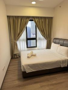 Ein Bett oder Betten in einem Zimmer der Unterkunft Agile Milestone service suite TRX by KL