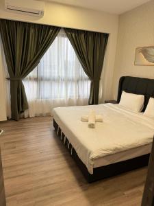 Ein Bett oder Betten in einem Zimmer der Unterkunft Agile Milestone service suite TRX by KL