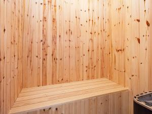 a wooden interior of a sauna with wooden walls at 6 person holiday home on a holiday park in Gråsten in Gråsten