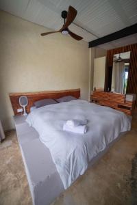 Postel nebo postele na pokoji v ubytování Cerro Tusa Springs
