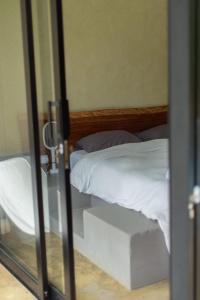 Postel nebo postele na pokoji v ubytování Cerro Tusa Springs