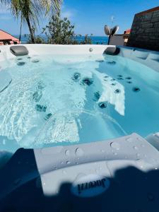 a pool of water with water droplets on it at Villa Aloe di Calanica Cefalù in Cefalù