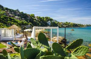 a resort with a view of the beach and the ocean at Villa Aloe di Calanica Cefalù in Cefalù