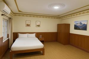 Letto o letti in una camera di Hotel Suva