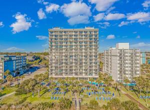 an aerial view of a tall building with umbrellas at Boardwalk Beach Resort in Myrtle Beach