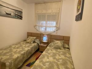 Postel nebo postele na pokoji v ubytování Apartamentos Marina Park