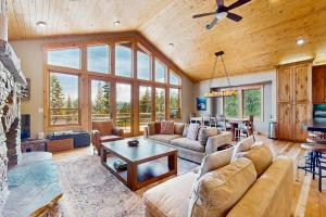 a living room with a couch and a table at Extraordinary Tahoe-Donner Modern Mountain Home in Truckee