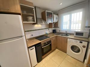 Kuchyň nebo kuchyňský kout v ubytování Apartamentos Marina Park