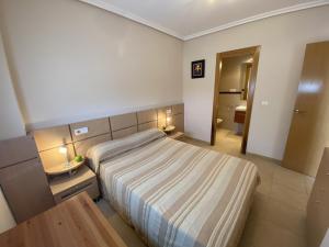 Postel nebo postele na pokoji v ubytování Apartamentos Marina Park